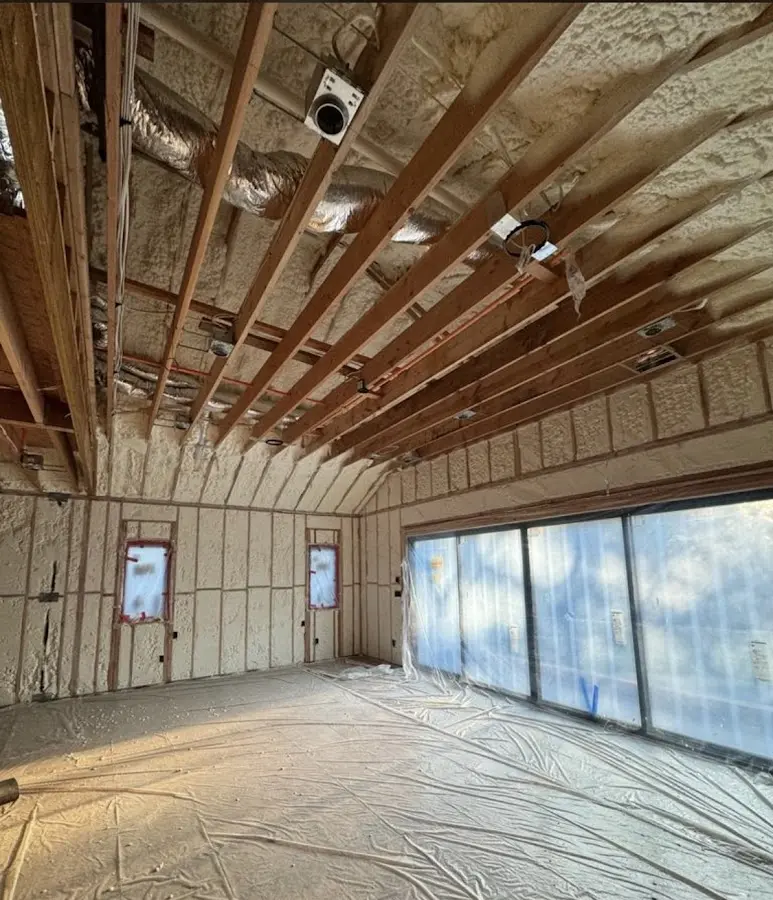 Interior walls and ceiling insulated with spray foam during new construction in Norwich